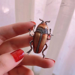 Vintage beetle brooch in bronze finish with black rhinestones and intricate bug details
