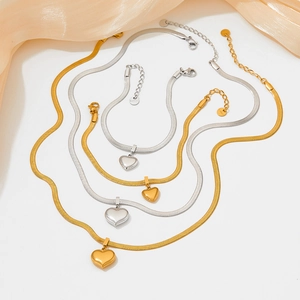 Stainless steel heart pendant necklace and bracelet set in gold and silver finish
