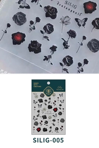 Macro detail of black and red rose floral nail stickers with butterfly motifs and packaging