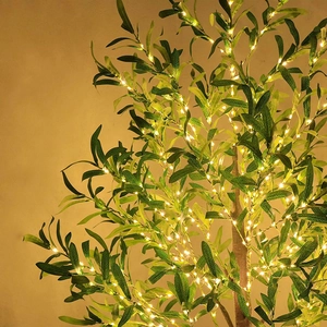 Artificial LED olive tree decoration with green leaves and warm white lights on brown trunk