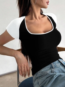Detail of slim fit Y2K contrast short sleeve top with black body and white raglan sleeves