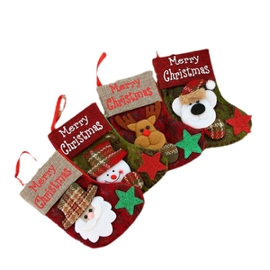 Vintage faux leather Christmas stockings with Santa, snowman, elk, and bear hanging ornaments