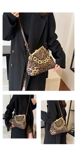 Detail of leopard print shell bag with chunky gold chain and brown leather strap