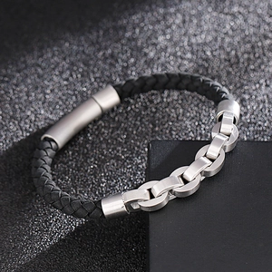 Men's woven leather bracelet with stainless steel magnetic clasp on a gift box