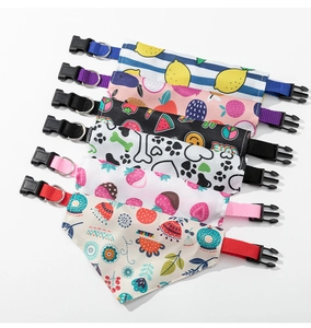 Detail view of assorted pet bandanas featuring vibrant patterns and metal D-rings