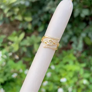 Adjustable 18K gold plated leaf ring featuring three layers of micro-set zircon accents