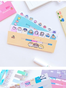 Macro detail of cute animal and fruit sticky notes in pink, blue and yellow designs