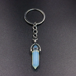 Detailed view of opalite hexagonal crystal pendant on a silver metal keychain ring