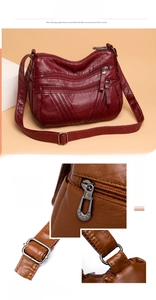 Macro detail of high-quality zippers and adjustable strap on a soft faux leather crossbody bag