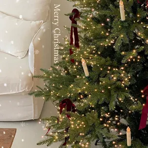 Christmas tree candle lights with warm LED string and red velvet bows for 2025 holiday decor