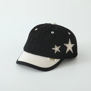Close-up of contrast kids baseball cap with star embroidery and soft suede finish