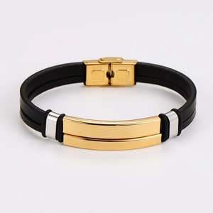 Close-up of black double-row leather cord with polished gold and silver steel clasp