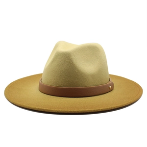 Detail of camel wool fedora hat featuring brown leather band and gold metal rivet detail