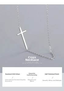 Macro shot of polished S925 sterling silver cross pendant with smooth mirror finish