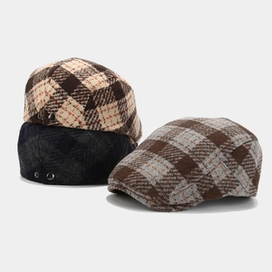 Vintage plaid newsboy cap in brown and blue wool blend with metal side button