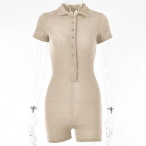 Detailed view of champagne glitter romper with polo collar and button placket on mannequin