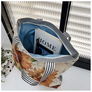 Detail view of sunflower canvas tote bag showing spacious interior with zipper closure