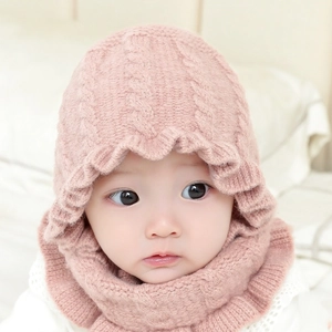 Pink knit baby beanie and scarf set with sweet ruffle trim for winter warmth