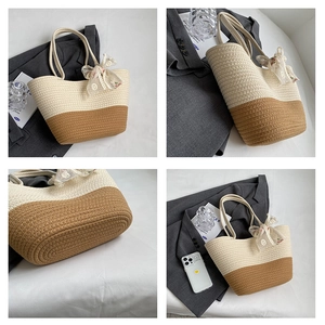 Detail view of woven straw tote bag with floral scarf and size reference