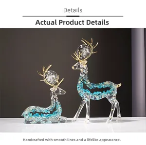 Detail of artistic resin deer figurines with blue crystals and gold foil inside