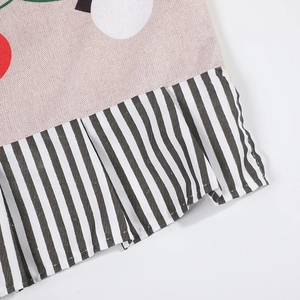 Linen Christmas chair cover featuring colorful polka dots and black white striped ruffle
