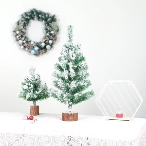 Miniature snow-flocked PVC Christmas trees with natural wood base for table decor