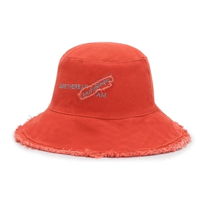 Orange frayed canvas bucket hat with retro embroidery and washed street style design