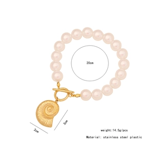 Detail view of pearl bracelet with gold shell charm showing 20cm length and 14.5g weight