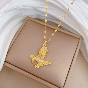 Elegant gold eagle pendant necklace with sparkling rhinestones on a delicate chain