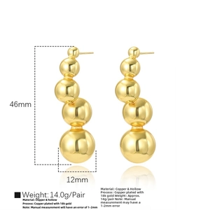 Detail showing 46mm drop earrings with five graduated 18k gold plated hollow spheres