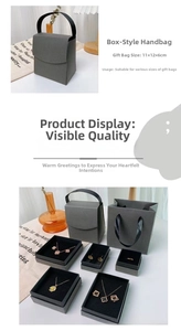 Detailed view of gray jewelry gift box with matching carry bag and ribbon handle