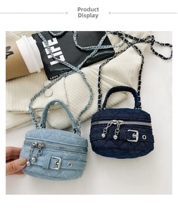 Close-up of mini denim crossbody bags with diamond quilting and metal chain straps