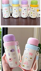 Macro shot of colorful cartoon stainless steel vacuum flasks with cute animal patterns