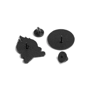 Enamel pin back set with dual butterfly clutches and black rubber caps on white background