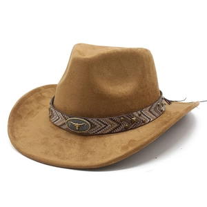 Close-up of brown suede cowboy hat with patterned band, metal studs and bull head emblem