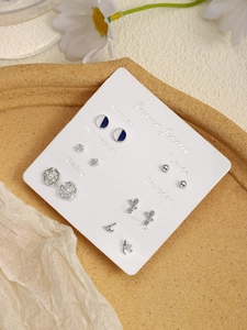 Detail of 6-pair silver earring set on a weekday card with animal and heart motifs