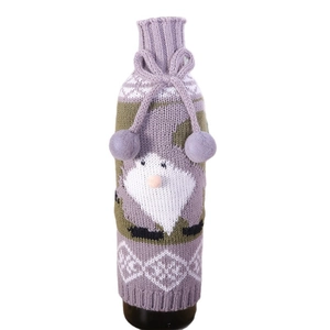 Knitted Christmas wine bottle cover featuring a purple gnome design with pom-poms