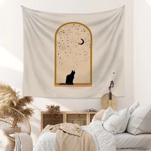Detail view of a minimalist wall tapestry featuring a black cat silhouette and a moon scene