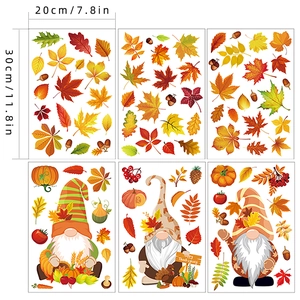 Detail view of 6-piece Thanksgiving window clings set with gnomes and maple leaves
