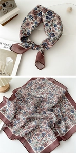 Close-up detail of vintage floral cotton linen neck scarf with blue and beige flower patterns
