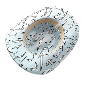 Detail view of light blue cowboy hat featuring seagull print and interior sweatband