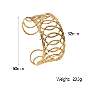 Detail view of gold cutout geometric bracelet showing dimensions 60mm height and 32mm width