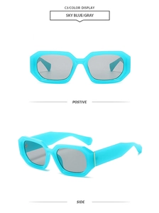 Detail view of sky blue geometric sunglasses with gray lenses and thick fashion frames