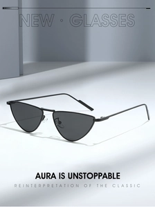 Close-up of triangle cat-eye sunglasses with black metal frame on a geometric background