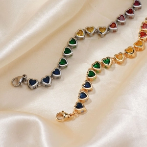 Close-up of heart-shaped rainbow zircon tennis bracelets in gold and silver plating
