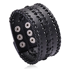 Detail of black woven leather punk bracelet featuring adjustable metal snap fasteners