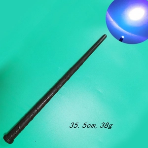 Detail of 35.5cm brown glowing wizard wand with close-up of LED light tip