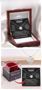 Rotating four-leaf clover necklace with cubic zirconia in premium wooden LED gift box