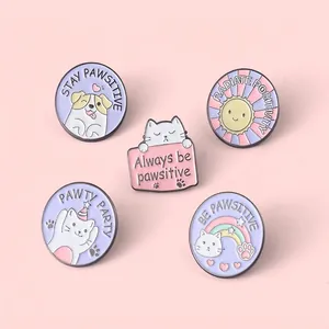 Set of five cute colorful animal enamel pins with positive quotes on pink background