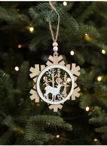 Macro detail of wooden snowflake ornament with reindeer silhouette and beads